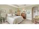 Well-lit bedroom with a comfortable bed and built-in dresser at 888 S Orange Ave # 3D, Sarasota, FL 34236