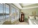Charming bedroom with water views and custom cabinetry at 888 S Orange Ave # 3D, Sarasota, FL 34236
