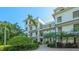 Exterior of a building with lush landscaping and a brick walkway leading to the entrance at 888 S Orange Ave # 3D, Sarasota, FL 34236