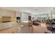 Open concept kitchen with island and modern appliances at 888 S Orange Ave # 3D, Sarasota, FL 34236