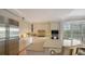 Modern kitchen with stainless steel appliances and light colored cabinets at 888 S Orange Ave # 3D, Sarasota, FL 34236