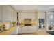 Modern kitchen with white cabinets, stainless steel appliances, and gas range at 888 S Orange Ave # 3D, Sarasota, FL 34236