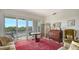 Spacious living room with water views and comfy seating at 888 S Orange Ave # 3D, Sarasota, FL 34236