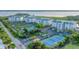 Aerial view of community, tennis court, and waterfront at 9203 Griggs Rd # B304, Englewood, FL 34224