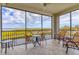 Spacious balcony with water views and seating for relaxing at 9203 Griggs Rd # B304, Englewood, FL 34224