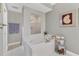 Bathroom with soaking tub and walk-in shower at 9203 Griggs Rd # B304, Englewood, FL 34224