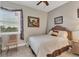 Small bedroom with window and view at 9203 Griggs Rd # B304, Englewood, FL 34224