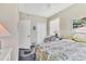 Guest bedroom with double bed and window seat at 9203 Griggs Rd # B304, Englewood, FL 34224