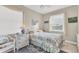Guest bedroom with wicker furniture and window seat at 9203 Griggs Rd # B304, Englewood, FL 34224
