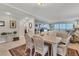 Bright dining room with a table and chairs near the living room at 9203 Griggs Rd # B304, Englewood, FL 34224