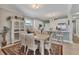 Light and airy dining area with table and chairs near kitchen at 9203 Griggs Rd # B304, Englewood, FL 34224