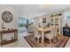 Elegant dining room with a table and chairs for six at 9203 Griggs Rd # B304, Englewood, FL 34224