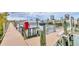 Community boat dock with multiple slips for various size boats at 9203 Griggs Rd # B304, Englewood, FL 34224