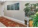 Bright entryway with rug, art, and plant at 9203 Griggs Rd # B304, Englewood, FL 34224