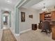 Bright hallway with access to bedroom and office at 9203 Griggs Rd # B304, Englewood, FL 34224