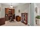 Home office features built-in cabinetry and comfortable seating at 9203 Griggs Rd # B304, Englewood, FL 34224