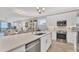 Modern kitchen with white cabinets and stainless steel appliances at 9203 Griggs Rd # B304, Englewood, FL 34224