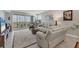 Relaxing living room with balcony access and water view at 9203 Griggs Rd # B304, Englewood, FL 34224