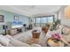 Spacious living room with water views and recessed lighting at 9203 Griggs Rd # B304, Englewood, FL 34224