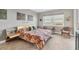 Main bedroom with water views and sitting area at 9203 Griggs Rd # B304, Englewood, FL 34224