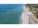 Beach pier and shoreline aerial view at 104 Capri Isles Blvd # 112, Venice, FL 34292
