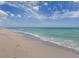 Expansive beach with clear water and blue sky at 104 Capri Isles Blvd # 112, Venice, FL 34292