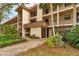 Building exterior showcasing landscaping and walkway at 104 Capri Isles Blvd # 112, Venice, FL 34292