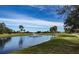 Serene golf course with pond and fountain at 104 Capri Isles Blvd # 112, Venice, FL 34292