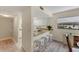 Modern kitchen with granite countertops and white cabinets at 104 Capri Isles Blvd # 112, Venice, FL 34292