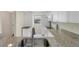 Well-equipped kitchen featuring granite counters and stainless steel appliances at 104 Capri Isles Blvd # 112, Venice, FL 34292