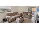 Living room featuring comfortable sofas and a relaxing atmosphere at 104 Capri Isles Blvd # 112, Venice, FL 34292
