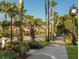 Scenic tree-lined street with clock and benches at 104 Capri Isles Blvd # 112, Venice, FL 34292