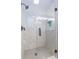 Modern bathroom with a glass-enclosed shower and patterned tile at 1110 2Nd S Ave, Tierra Verde, FL 33715