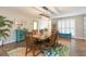 Spacious dining room with a large table and colorful area rug at 1110 2Nd S Ave, Tierra Verde, FL 33715