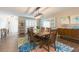 Spacious dining room with a large table and colorful area rug at 1110 2Nd S Ave, Tierra Verde, FL 33715
