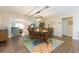 Spacious dining room with a large table and colorful area rug at 1110 2Nd S Ave, Tierra Verde, FL 33715