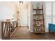 Bright and airy entryway with decorative shelving and console table at 1110 2Nd S Ave, Tierra Verde, FL 33715