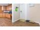Entryway with wood-look floors and a view into the kitchen at 1110 2Nd S Ave, Tierra Verde, FL 33715