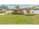 Beautiful single-story home with well-manicured lawn at 1110 2Nd S Ave, Tierra Verde, FL 33715
