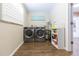 Laundry room with washer, dryer, and shelving for storage at 1110 2Nd S Ave, Tierra Verde, FL 33715