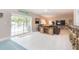 Bright living room with sliding doors leading to a pool and patio at 1110 2Nd S Ave, Tierra Verde, FL 33715
