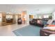 Relaxing living room with sectional sofa and view to dining area at 1110 2Nd S Ave, Tierra Verde, FL 33715