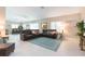 Relaxing living room with sectional sofa and view to dining area at 1110 2Nd S Ave, Tierra Verde, FL 33715