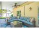 Covered patio with comfortable seating and ceiling fan at 1110 2Nd S Ave, Tierra Verde, FL 33715