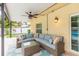 Covered patio with a comfortable seating area at 1110 2Nd S Ave, Tierra Verde, FL 33715