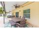 Outdoor patio with a dining table and seating area at 1110 2Nd S Ave, Tierra Verde, FL 33715