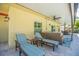 Comfortable patio with striped lounge chairs and side table at 1110 2Nd S Ave, Tierra Verde, FL 33715