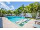 Expansive pool and spa with fire features and tropical landscaping at 1110 2Nd S Ave, Tierra Verde, FL 33715
