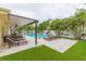 Relaxing pool area with patio furniture and a covered patio at 1110 2Nd S Ave, Tierra Verde, FL 33715