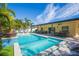 Resort-style pool with spacious deck and lush landscaping at 1110 2Nd S Ave, Tierra Verde, FL 33715